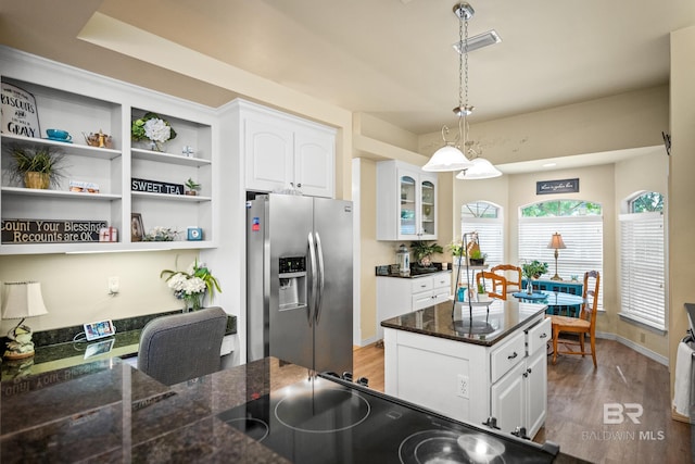 11346 County Road 99, Lillian, AL 36549 - kitchen featuring stainless steel refrigerator with ice dispenser, light wood-style floors, white cabinetry, decorative light fixtures, and open shelves
