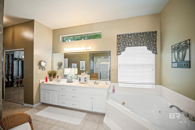 11346 County Road 99, Lillian, AL 36549 - bathroom featuring double vanity, a whirlpool tub, a stall shower, and tile patterned flooring
