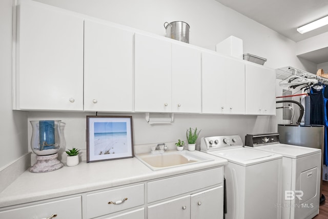 11346 County Road 99, Lillian, AL 36549 - laundry area featuring cabinet space and separate washer and dryer