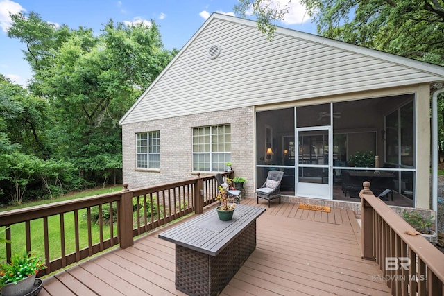 11346 County Road 99, Lillian, AL 36549 - deck featuring a sunroom and a lawn