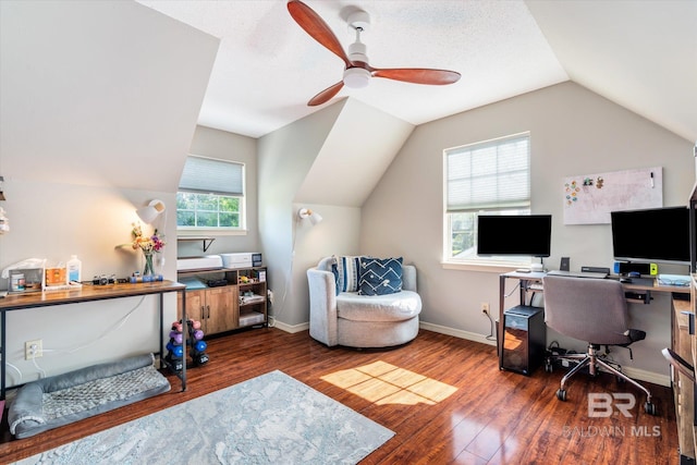 office space featuring dark hardwood / wood-style flooring, lofted ceiling, ceiling fan, and plenty of natural light