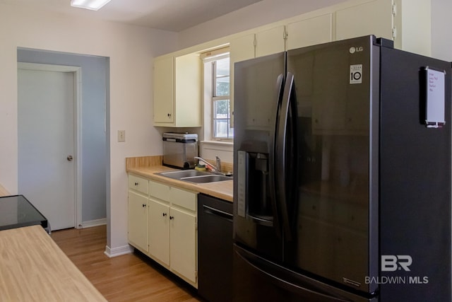 kitchen with sink, dishwasher, stove, light hardwood / wood-style flooring, and refrigerator with ice dispenser