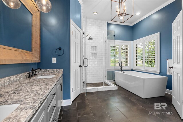 bathroom with vanity, crown molding, independent shower and bath, an inviting chandelier, and tile patterned floors