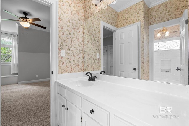 bathroom featuring ornamental molding, ceiling fan, and vanity