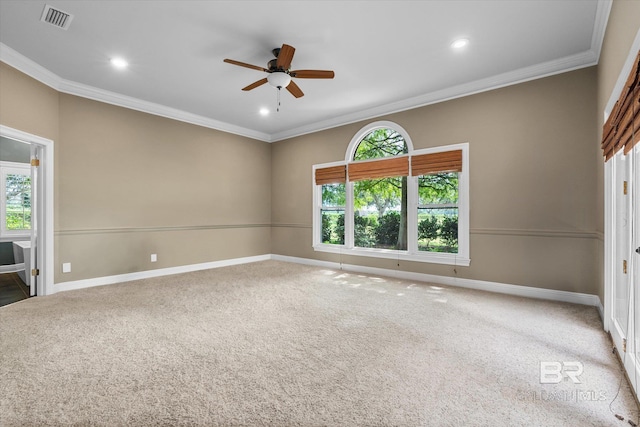 carpeted empty room featuring ceiling fan and ornamental molding