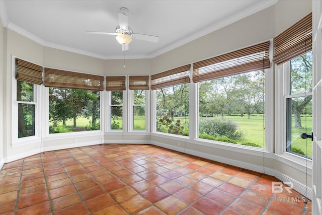 unfurnished sunroom with a wealth of natural light and ceiling fan