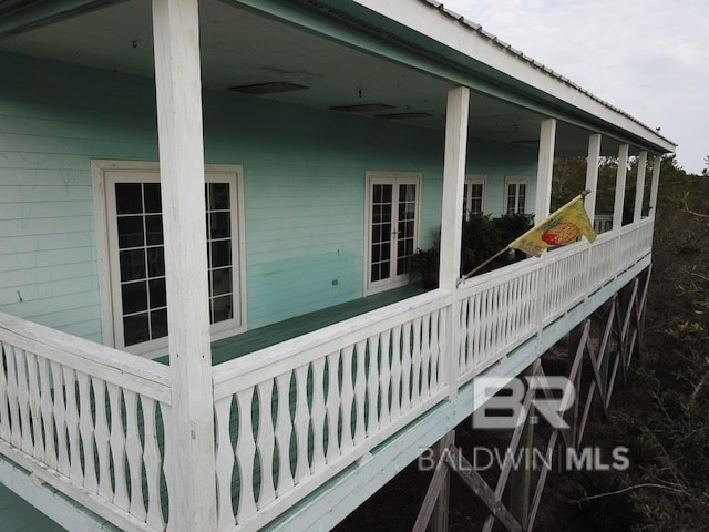 view of side of property with french doors