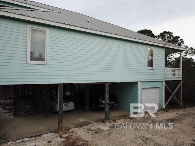 back of house with a garage