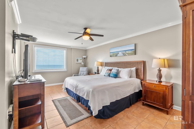 bedroom featuring light tile patterned floors, crown molding, ceiling fan, and baseboards