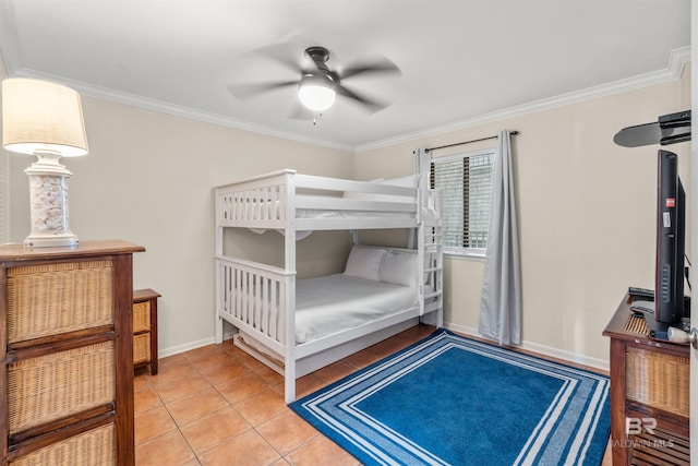 bedroom with ornamental molding, light tile patterned floors, and baseboards