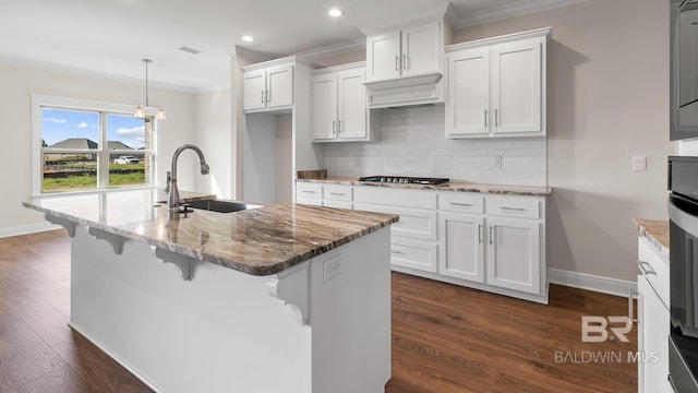 10253 Secretariat Blvd, Daphne, AL 36526 - kitchen featuring a sink, ornamental molding, white cabinets, baseboards, and decorative backsplash