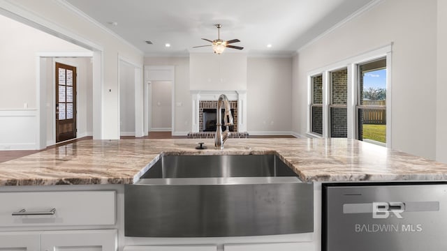10253 Secretariat Blvd, Daphne, AL 36526 - kitchen with a sink, stainless steel dishwasher, open floor plan, a ceiling fan, and crown molding