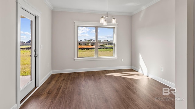 10253 Secretariat Blvd, Daphne, AL 36526 - spare room featuring dark wood-style flooring, baseboards, ornamental molding, and a chandelier