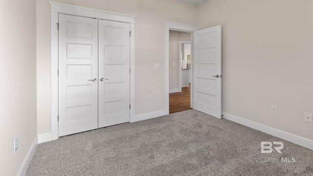 10253 Secretariat Blvd, Daphne, AL 36526 - unfurnished bedroom with carpet flooring, a closet, and baseboards