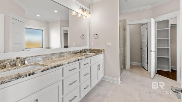 10253 Secretariat Blvd, Daphne, AL 36526 - full bath featuring double vanity, a shower stall, ornamental molding, a walk in closet, and baseboards