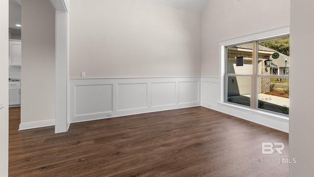 10253 Secretariat Blvd, Daphne, AL 36526 - unfurnished room featuring wainscoting, dark wood-style floors, and vaulted ceiling