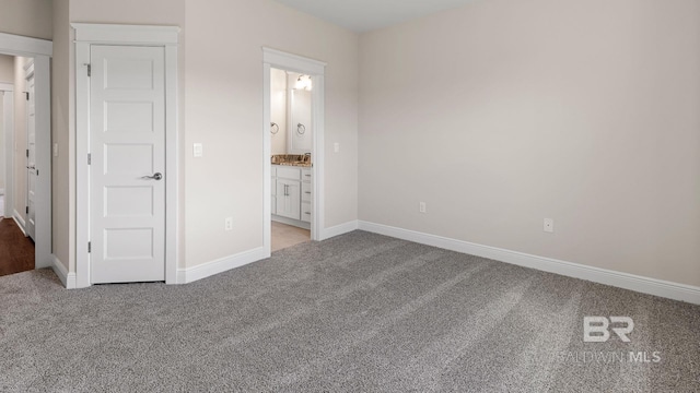 10253 Secretariat Blvd, Daphne, AL 36526 - unfurnished bedroom with light colored carpet, baseboards, and ensuite bath