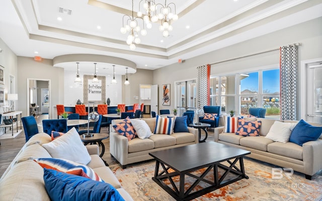 10253 Secretariat Blvd, Daphne, AL 36526 - living area featuring a chandelier, a raised ceiling, light wood-type flooring, recessed lighting, and crown molding