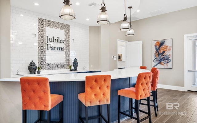 10253 Secretariat Blvd, Daphne, AL 36526 - bar with baseboards, hanging light fixtures, recessed lighting, and wood tiled floors