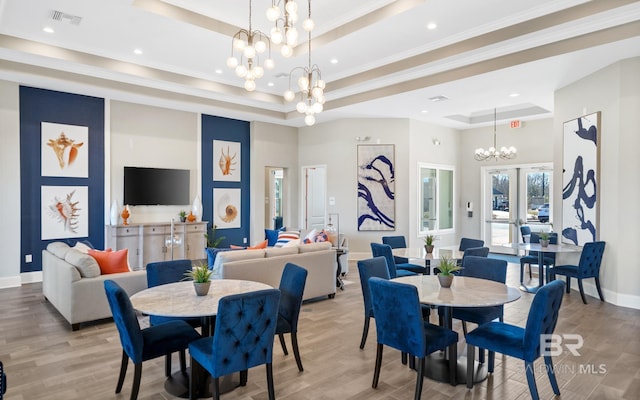 10253 Secretariat Blvd, Daphne, AL 36526 - dining area featuring a tray ceiling, a chandelier, light wood finished floors, crown molding, and recessed lighting