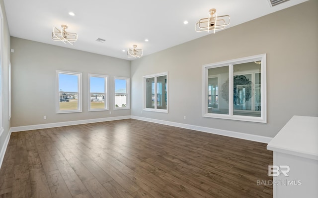 10253 Secretariat Blvd, Daphne, AL 36526 - empty room featuring dark wood finished floors, a chandelier, baseboards, and recessed lighting