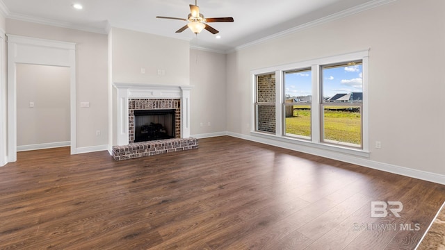 10253 Secretariat Blvd, Daphne, AL 36526 - unfurnished living room with ceiling fan, dark wood finished floors, crown molding, recessed lighting, and a brick fireplace