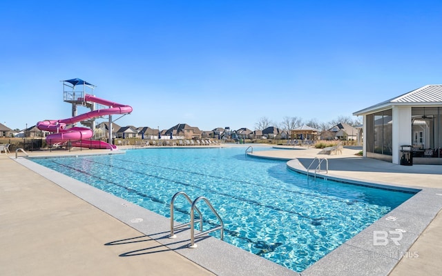 10253 Secretariat Blvd, Daphne, AL 36526 - community pool with a water slide, a patio area, a residential view, and a sunroom