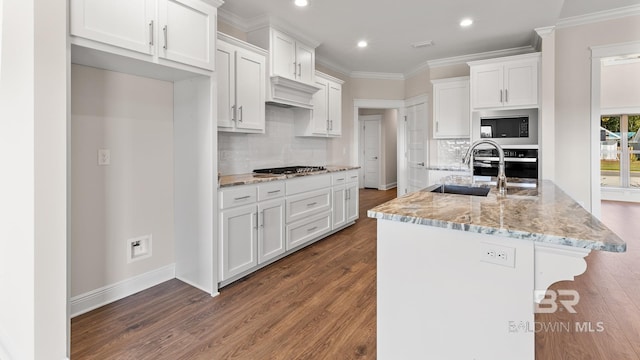 10253 Secretariat Blvd, Daphne, AL 36526 - kitchen with white cabinetry, wood finished floors, recessed lighting, ornamental molding, and stainless steel appliances