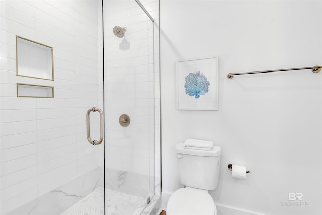 bathroom with walk in shower and toilet