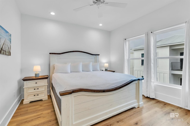 bedroom featuring light hardwood / wood-style floors and ceiling fan