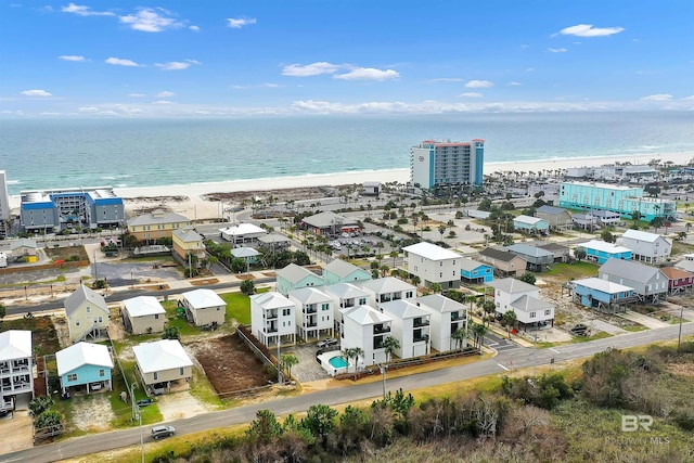 aerial view featuring a water view and a beach view