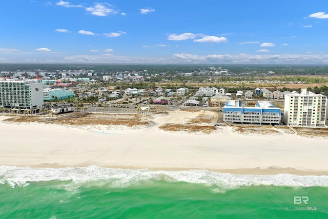 bird's eye view featuring a water view and a beach view