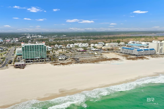 birds eye view of property with a view of the beach and a water view