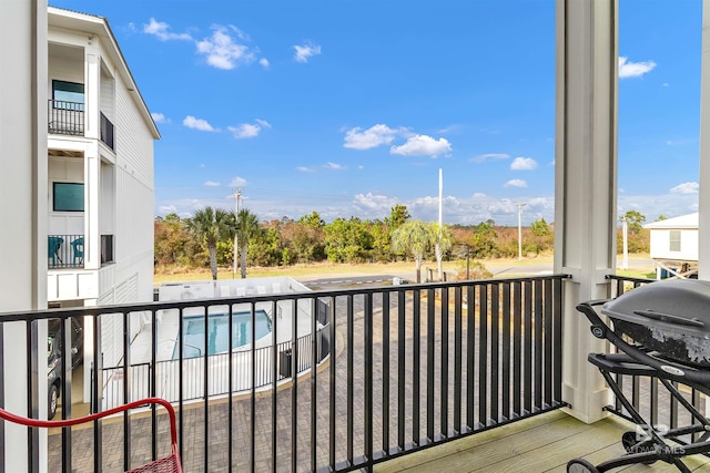 balcony featuring area for grilling