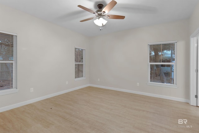 spare room with ceiling fan and light hardwood / wood-style flooring