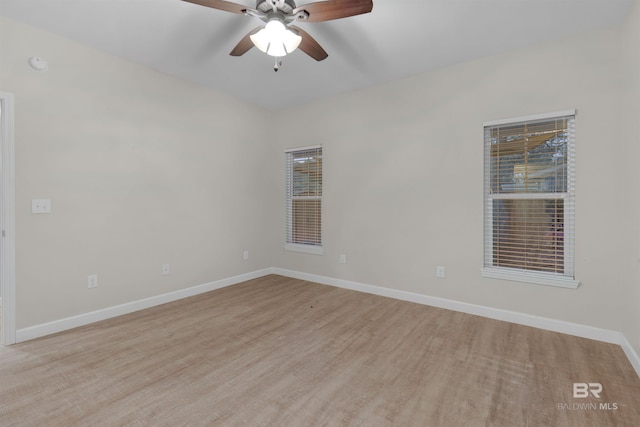 unfurnished room with light wood-type flooring and ceiling fan