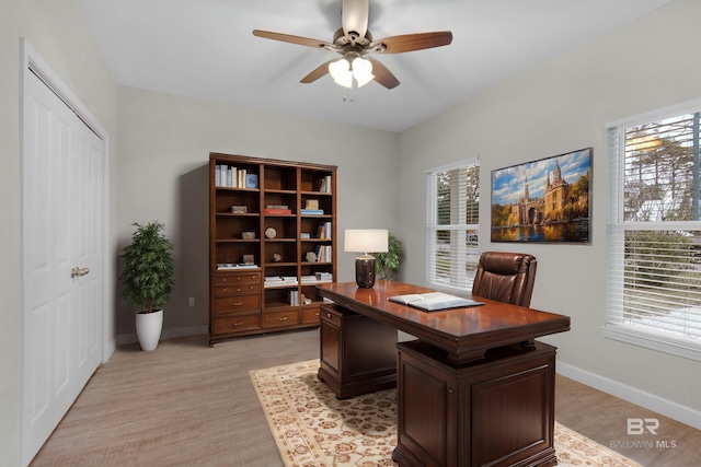 office space with ceiling fan and light hardwood / wood-style floors