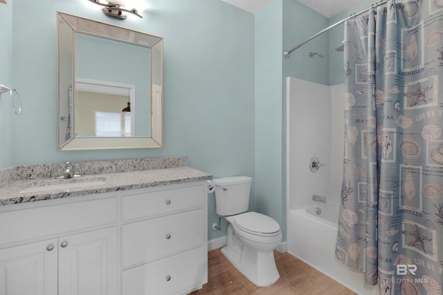 full bathroom featuring toilet, wood-type flooring, vanity, and shower / bathtub combination with curtain