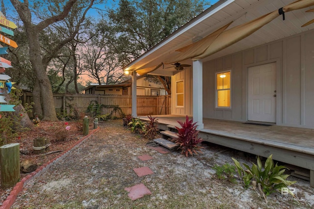 exterior space featuring ceiling fan