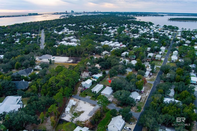 aerial view at dusk with a water view