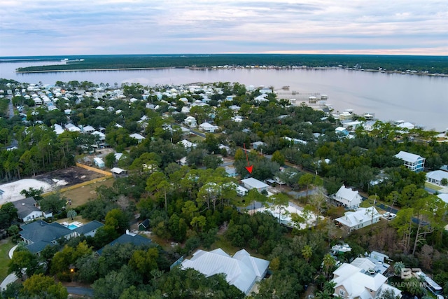 aerial view at dusk with a water view