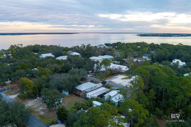 aerial view at dusk with a water view