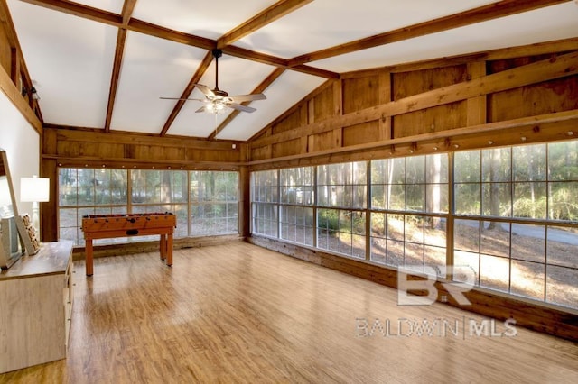 sunroom / solarium with vaulted ceiling with beams and ceiling fan