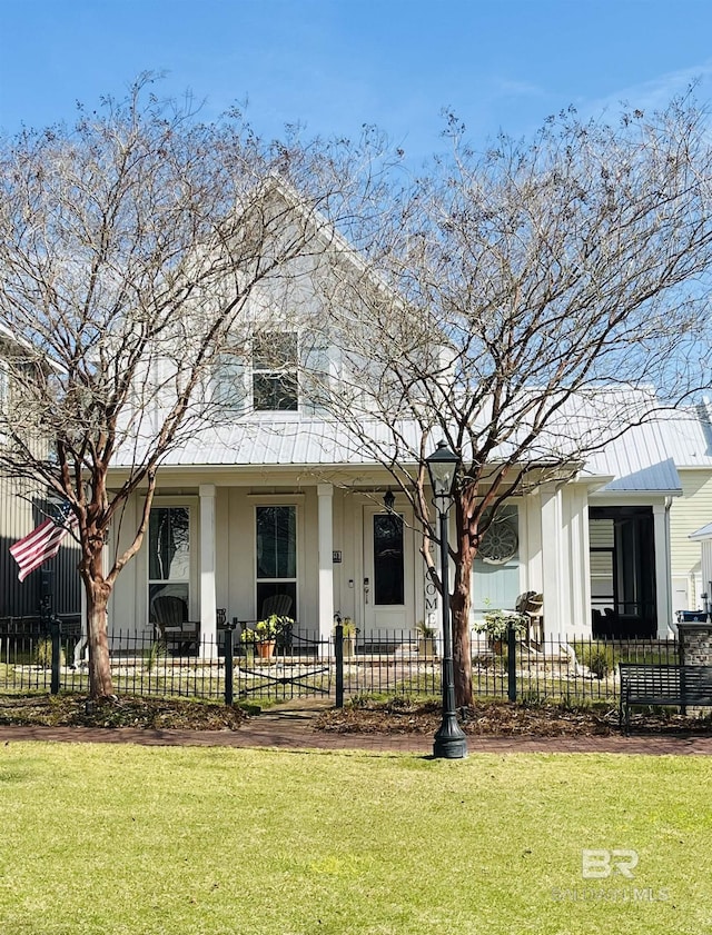 view of front of home with a fenced front yard and a front yard