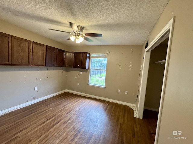 43265 Jones Rd, Bay Minette, AL 36507 - kitchen with dark wood-style floors, a textured ceiling, ceiling fan, and dark brown cabinets
