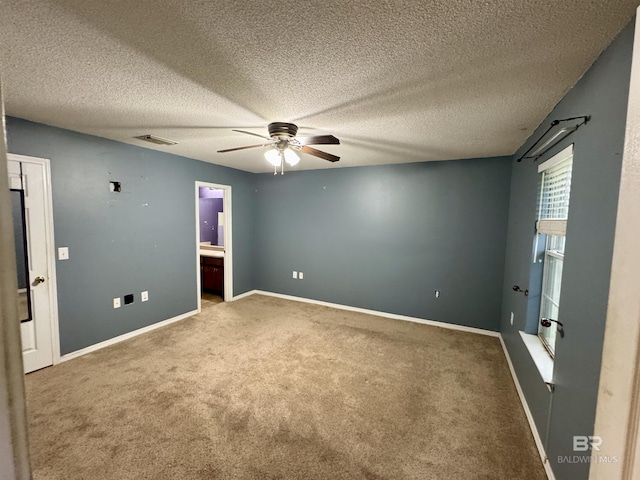 43265 Jones Rd, Bay Minette, AL 36507 - unfurnished bedroom with carpet, ensuite bath, a textured ceiling, and ceiling fan