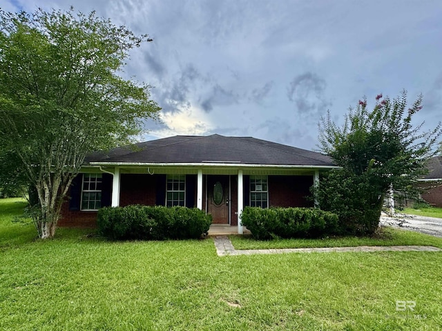 43265 Jones Rd, Bay Minette, AL 36507 - ranch-style house featuring a front lawn, covered porch, and brick siding