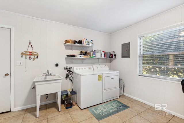 laundry room with washing machine and clothes dryer, electric panel, laundry area, and light tile patterned flooring