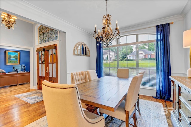 30230 Dolive Rdg, Daphne, AL 36527 - dining space featuring a chandelier, crown molding, and light wood-type flooring