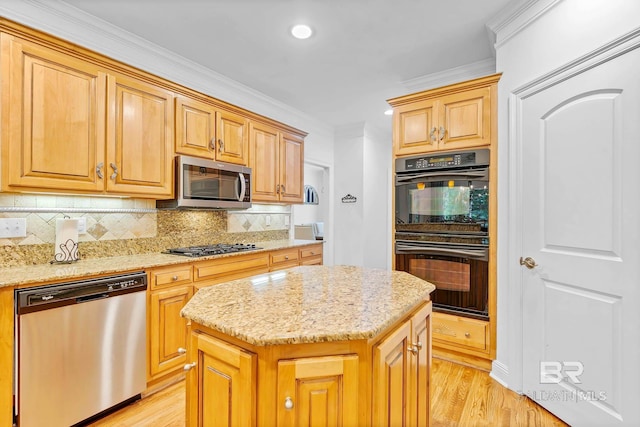 30230 Dolive Rdg, Daphne, AL 36527 - kitchen with appliances with stainless steel finishes, ornamental molding, light stone counters, decorative backsplash, and light wood finished floors